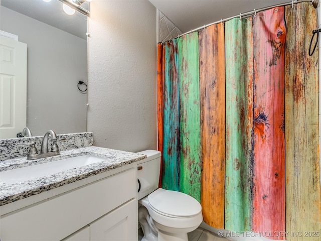 13902 S 241st E Ave, Coweta, OK 74429 - bathroom with vanity, toilet, a textured wall, and a shower with shower curtain