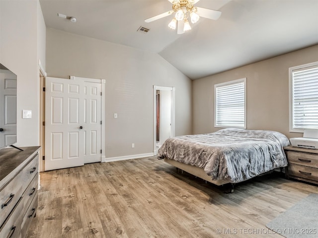 bedroom with visible vents, a ceiling fan, vaulted ceiling, light wood-type flooring, and baseboards