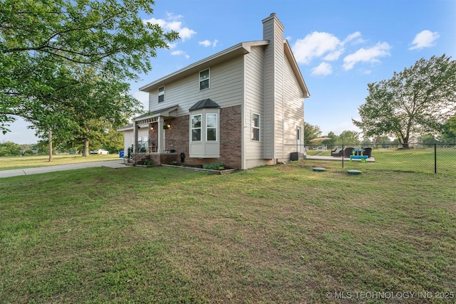 13902 S 241st E Ave, Coweta, OK 74429 - traditional home featuring a chimney, concrete driveway, and brick siding