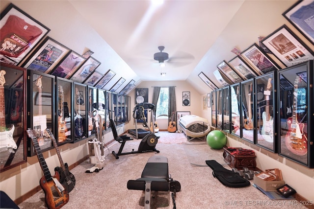 exercise room featuring vaulted ceiling and carpet floors