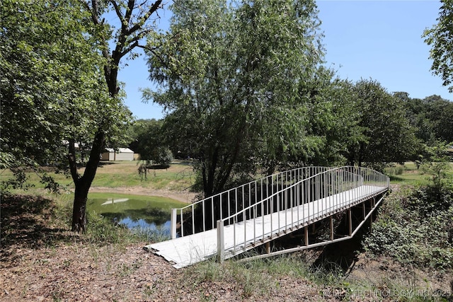 surrounding community featuring a water view