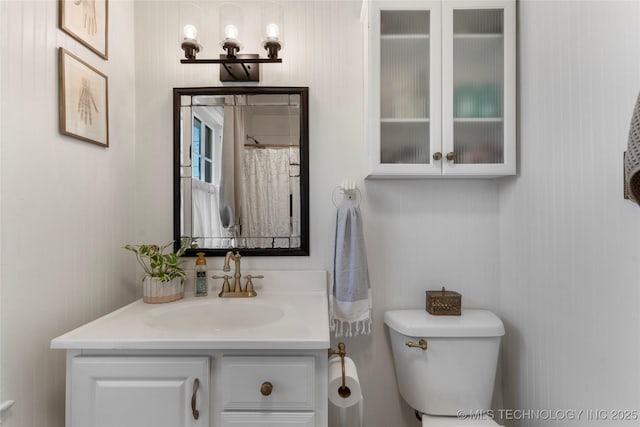 full bathroom featuring toilet and vanity