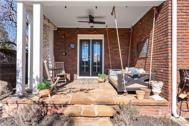 view of patio / terrace featuring ceiling fan and french doors