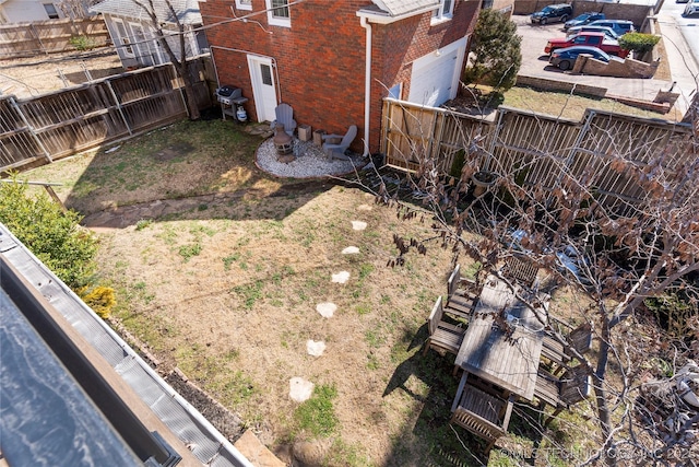 view of yard with a fenced backyard