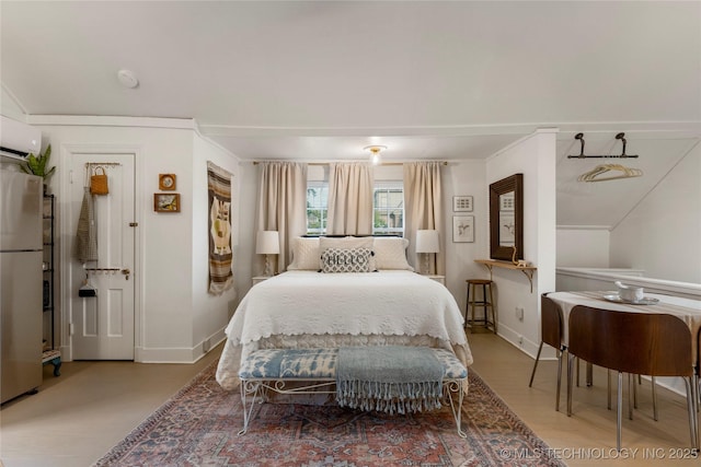 bedroom featuring crown molding, wood finished floors, freestanding refrigerator, and baseboards