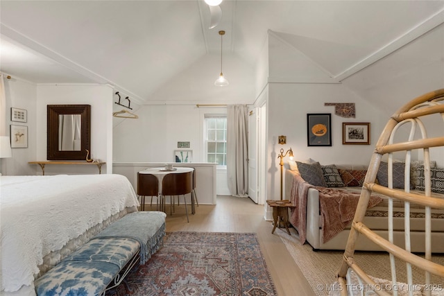 bedroom featuring vaulted ceiling and wood finished floors