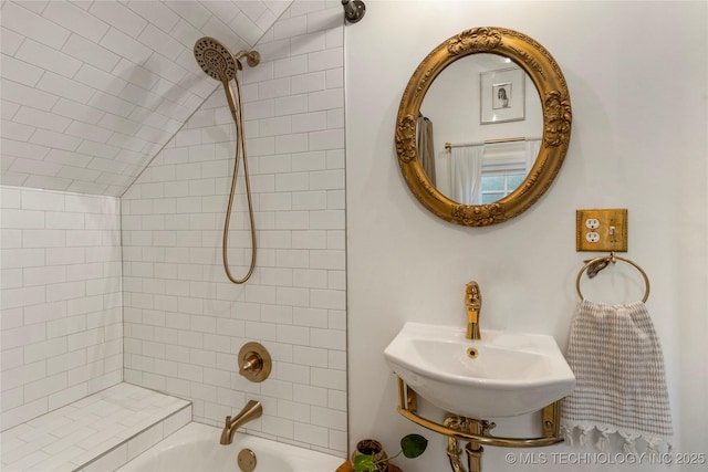 full bathroom featuring lofted ceiling, a sink, and shower / bathtub combination