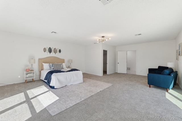 bedroom with visible vents and light colored carpet
