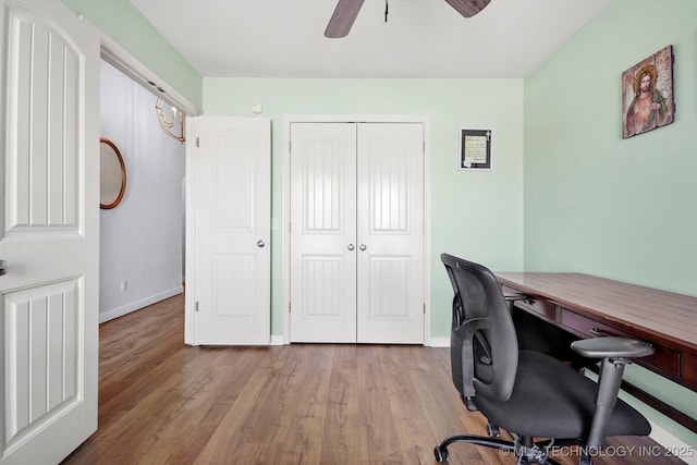 office area featuring ceiling fan, baseboards, and wood finished floors