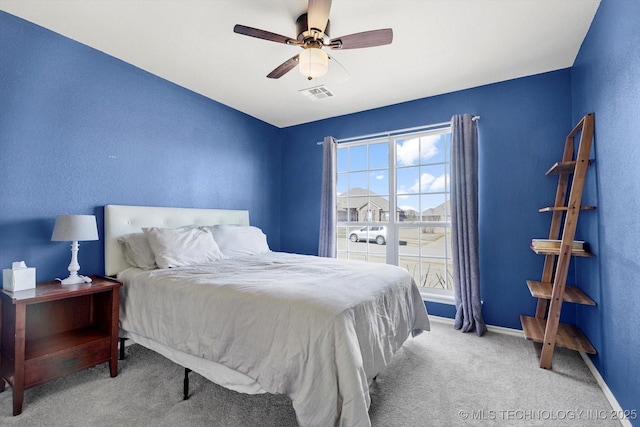 bedroom featuring carpet, visible vents, ceiling fan, and baseboards