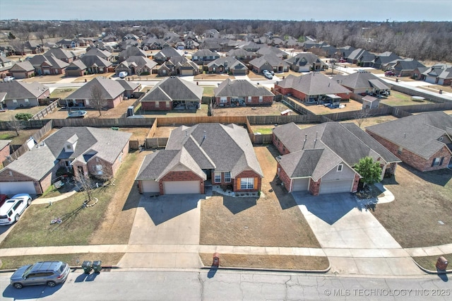 birds eye view of property with a residential view