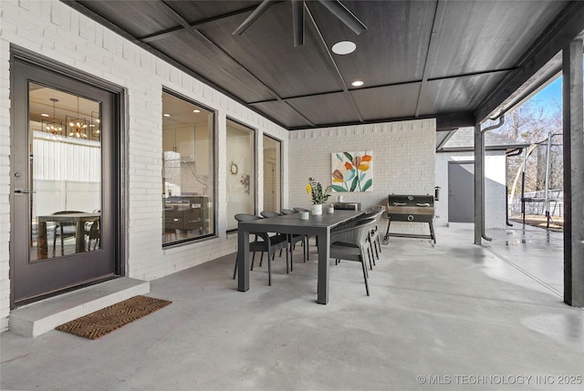 view of patio / terrace with outdoor dining area, ceiling fan, and grilling area