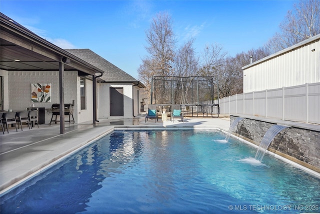 view of pool with fence, a fenced in pool, and a patio