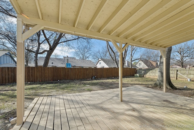 wooden deck featuring a patio and a fenced backyard