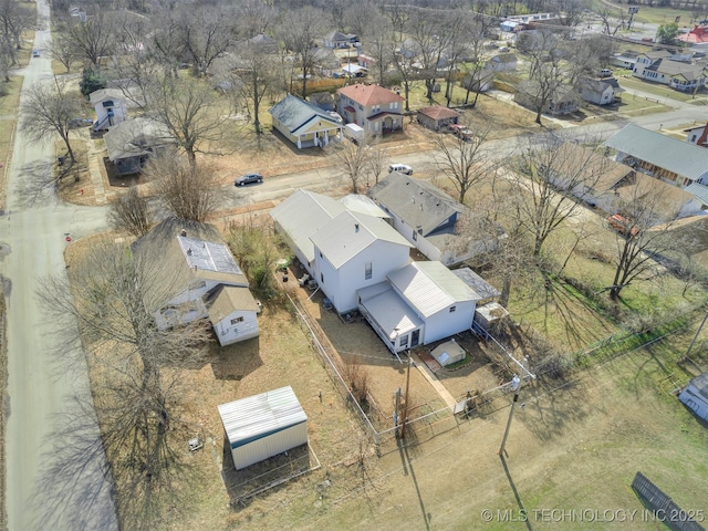 birds eye view of property with a residential view