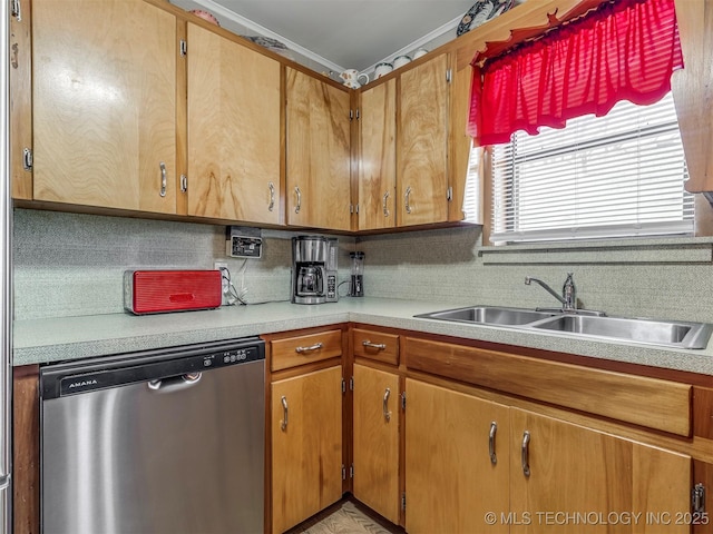 kitchen with tasteful backsplash, light countertops, dishwasher, and a sink