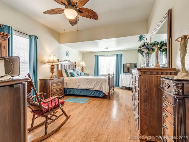 bedroom with light wood-style floors and ceiling fan