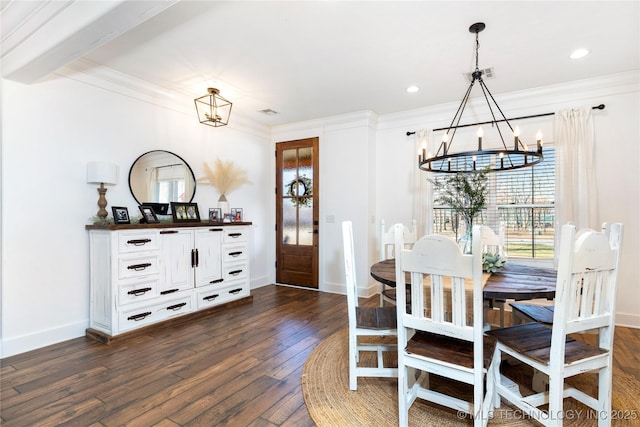 dining space featuring a chandelier, dark wood-style flooring, visible vents, baseboards, and crown molding