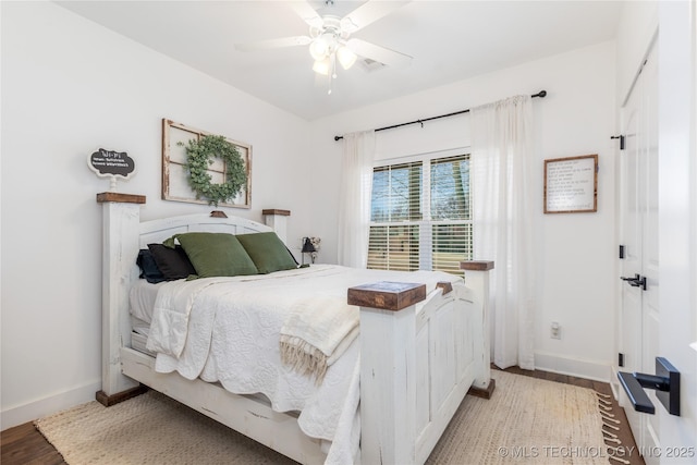 bedroom featuring ceiling fan, light wood-type flooring, visible vents, and baseboards