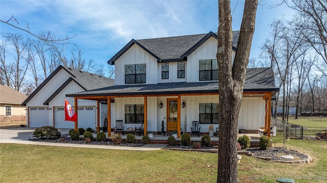 modern farmhouse featuring covered porch, a shingled roof, concrete driveway, a front lawn, and board and batten siding