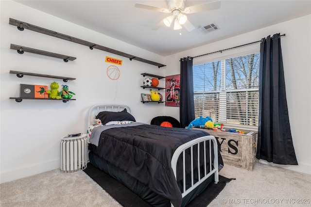 bedroom featuring carpet floors, visible vents, baseboards, and a ceiling fan