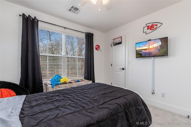 bedroom with a ceiling fan, carpet, visible vents, and baseboards