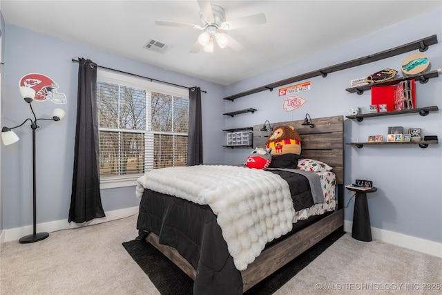 bedroom featuring baseboards, visible vents, and carpet flooring