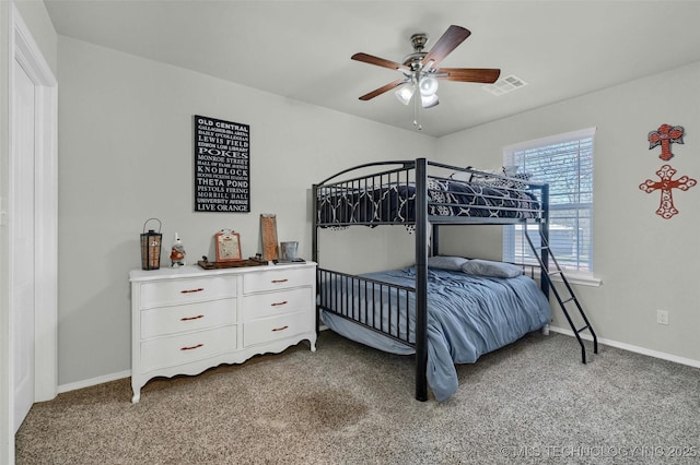 carpeted bedroom featuring visible vents, ceiling fan, and baseboards