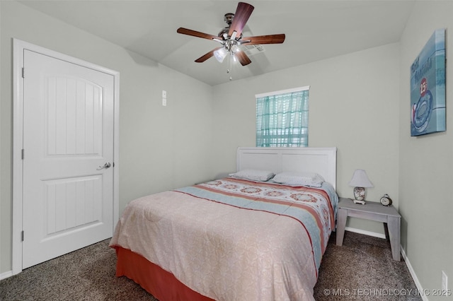 bedroom with ceiling fan, carpet, and baseboards