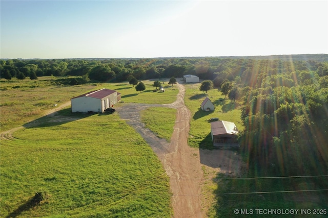 birds eye view of property featuring a rural view