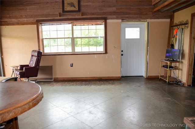 foyer entrance featuring baseboards