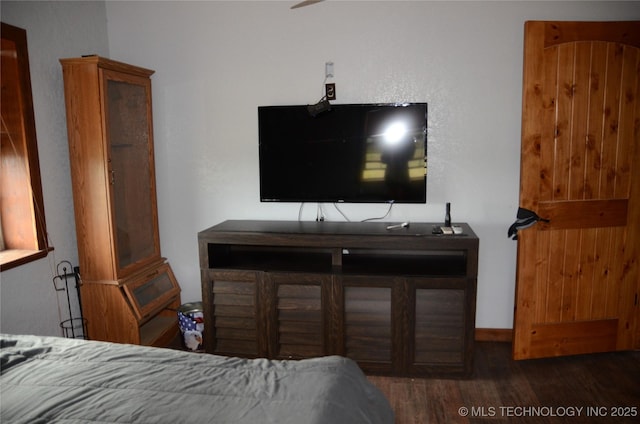 bedroom featuring wood finished floors