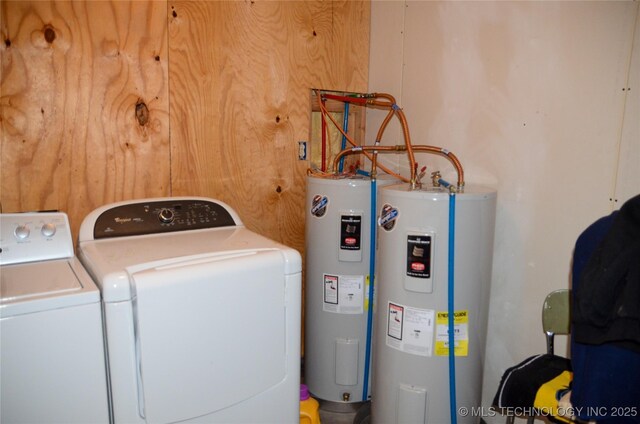 laundry area featuring laundry area, water heater, and washing machine and clothes dryer