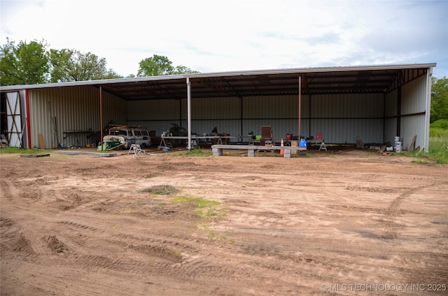 view of pole building with driveway