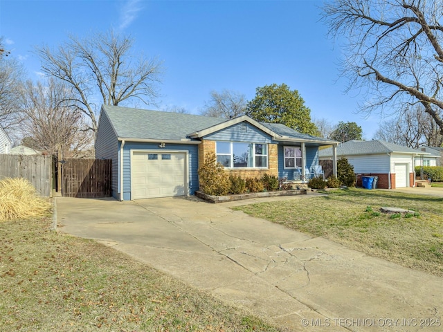 ranch-style home featuring a garage, fence, a front lawn, and concrete driveway