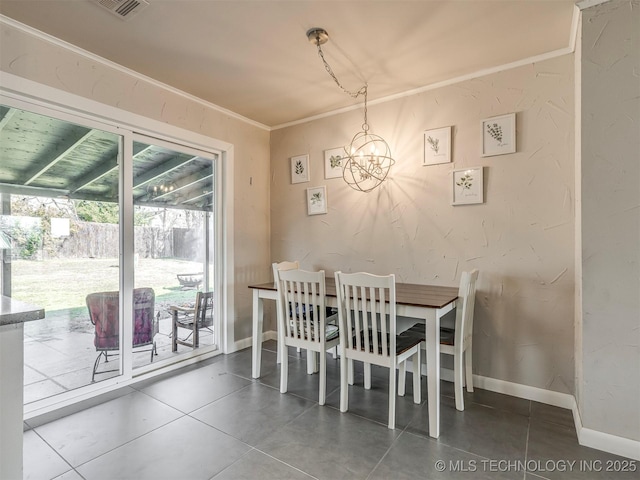 dining room featuring baseboards, an inviting chandelier, visible vents, and crown molding