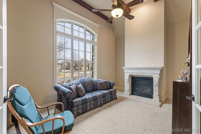 11870 S Oswego Ave, Tulsa, OK 74137 - carpeted living area featuring ceiling fan, a high end fireplace, beam ceiling, and baseboards