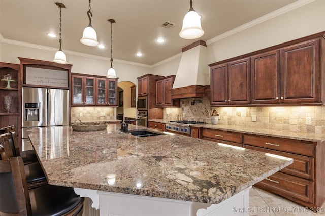 11870 S Oswego Ave, Tulsa, OK 74137 - kitchen featuring premium range hood, arched walkways, a sink, tasteful backsplash, and stainless steel appliances