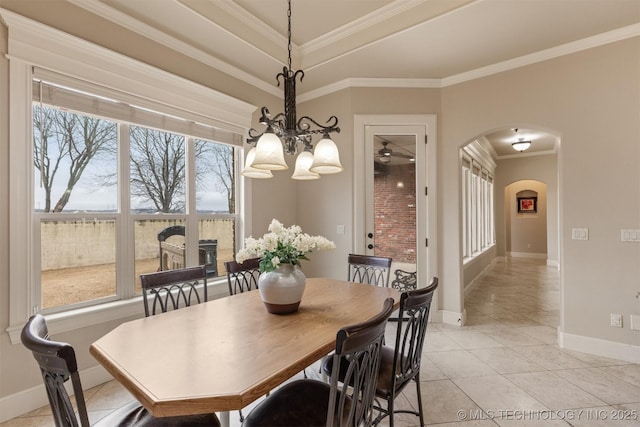 11870 S Oswego Ave, Tulsa, OK 74137 - dining area with arched walkways, a chandelier, baseboards, light tile patterned floors, and ornamental molding