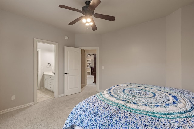 11870 S Oswego Ave, Tulsa, OK 74137 - bedroom featuring light carpet, baseboards, connected bathroom, and ceiling fan