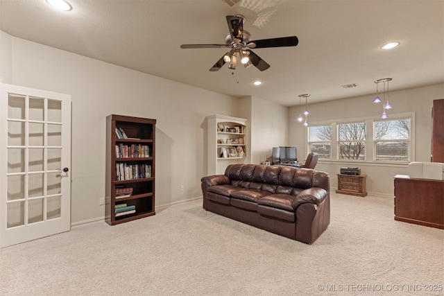 11870 S Oswego Ave, Tulsa, OK 74137 - carpeted living room with baseboards, a ceiling fan, recessed lighting, and a desk
