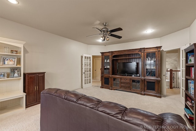 11870 S Oswego Ave, Tulsa, OK 74137 - living room with light colored carpet, ceiling fan, and recessed lighting