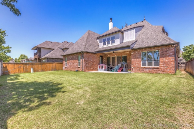 11870 S Oswego Ave, Tulsa, OK 74137 - rear view of house featuring a ceiling fan, a patio area, brick siding, a chimney, and a shingled roof
