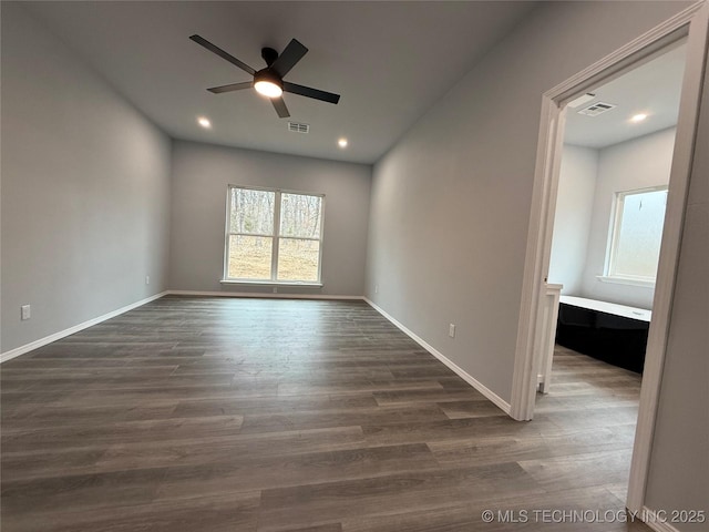 unfurnished room featuring ceiling fan, baseboards, dark wood-type flooring, and recessed lighting