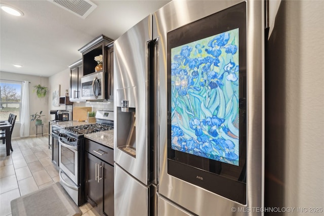 kitchen with open shelves, tasteful backsplash, visible vents, appliances with stainless steel finishes, and light tile patterned flooring