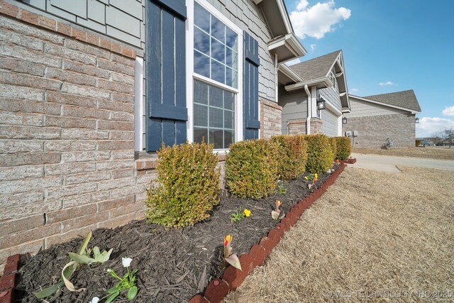 view of property exterior featuring brick siding