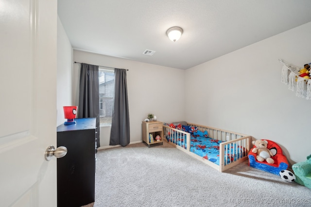 carpeted bedroom with visible vents