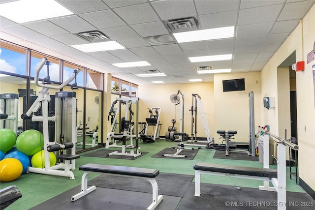 workout area featuring a drop ceiling and visible vents