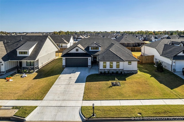 view of front of property with a residential view, driveway, and a front lawn