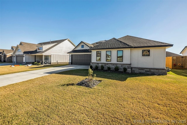 view of front facade with metal roof, fence, concrete driveway, a standing seam roof, and a front yard